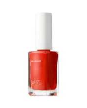 Red nail polish bottle with a white cap on a white background