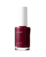 Bottle of nail lacquer with a white cap on a white background