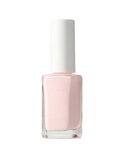 Pink nail polish bottle with white cap on a white background